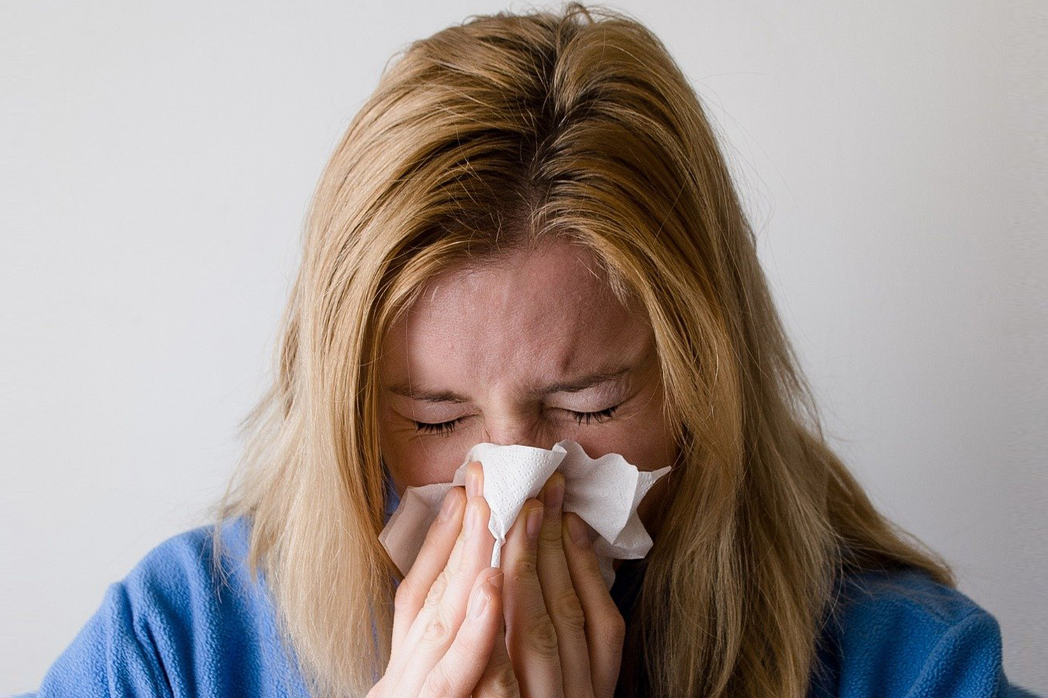 woman sick ith the colld or flu tennessee telelhealth